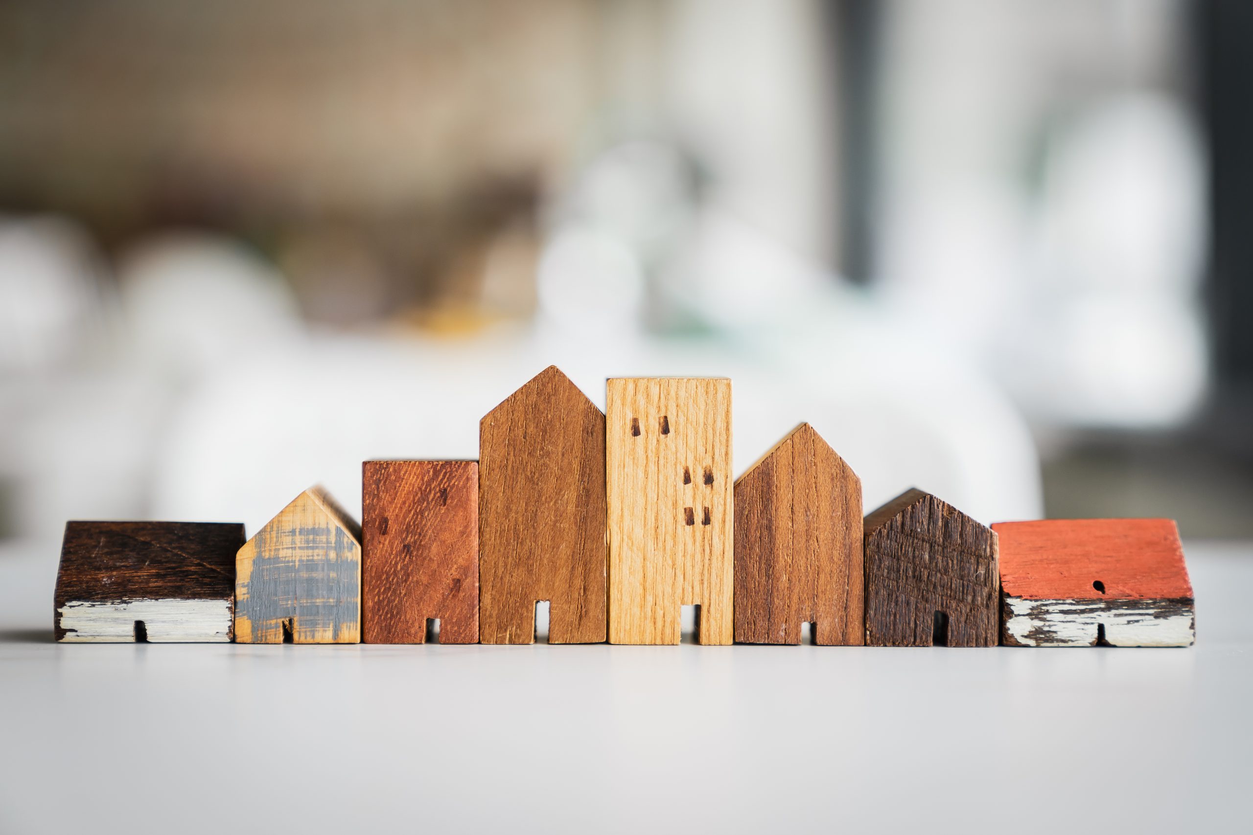 House model on wood table. Real estate agent offer house, property insurance and security, affordable housing concepts