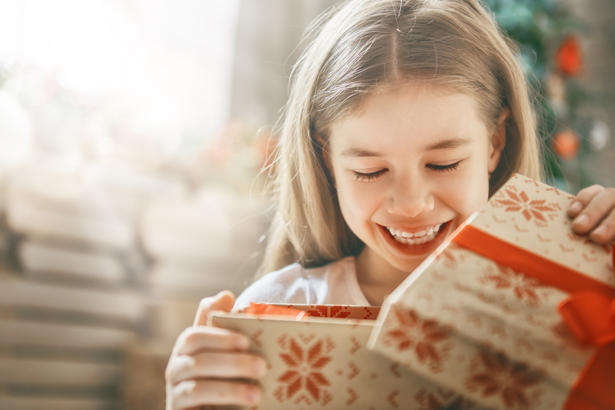 child opening gift