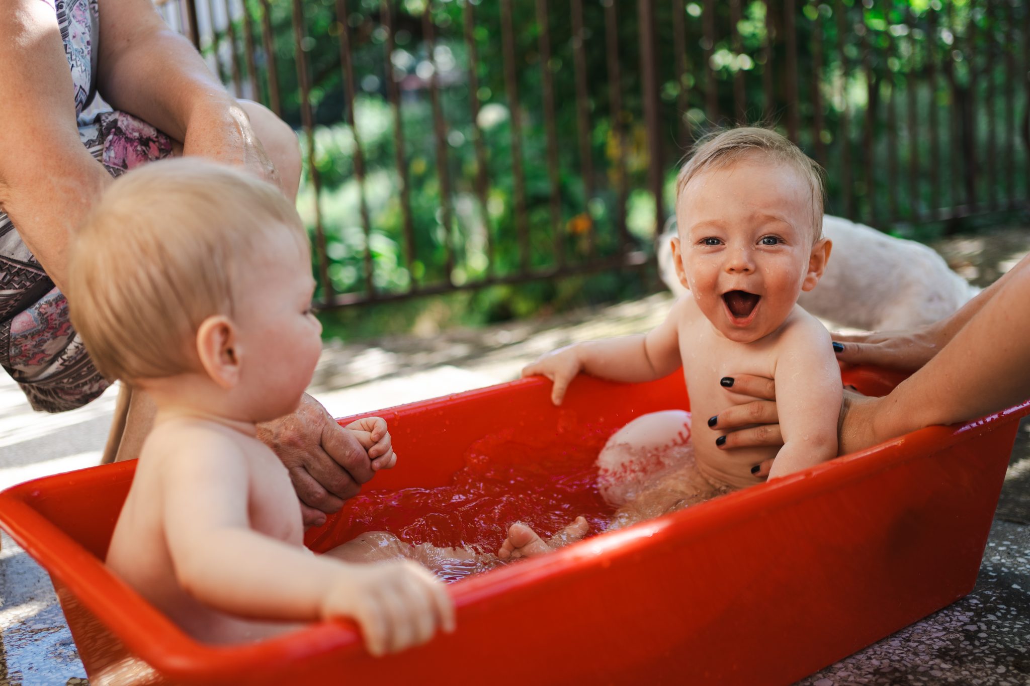 Multigeneration family enjoying summer days outside house